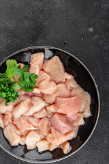 Chicken raw meat pieces of meat poultry tasty fresh delicious gourmet food background on table rustic food top view copy space keto and paleo diet