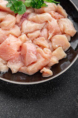 Chicken raw meat pieces of meat poultry tasty fresh delicious gourmet food background on table rustic food top view copy space keto and paleo diet