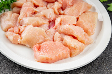 Chicken raw meat pieces of meat poultry tasty fresh delicious gourmet food background on table rustic food top view copy space keto and paleo diet