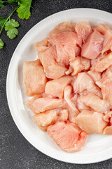 Chicken raw meat pieces of meat poultry tasty fresh delicious gourmet food background on table rustic food top view copy space keto and paleo diet