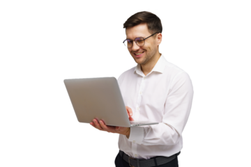 Smiling man in white shirt working on laptop while standing against a white background