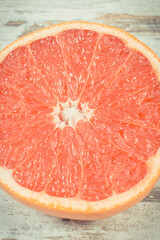 Ripe grapefruit on rustic board. Fruits as source minerals and vitamins