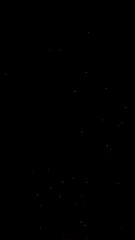 Hot sparks flying in the air isolated on black background