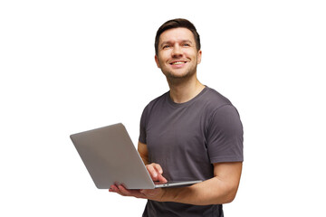 Man smiling while using a laptop, seemingly engaged in a positive activity at home