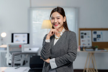 Portrait of a smiling businesswoman standing in a modern office, exuding confidence and professionalism