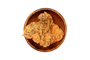 Fried chicken served on a wooden plate, isolated on white background