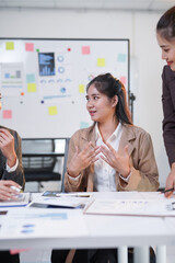 Business team working together on marketing strategy, analyzing financial statistics and planning partnership strategy at office