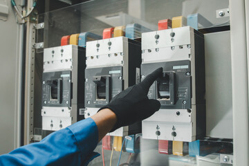 Electrical equipment maintenance service engineer Engineers carry AC voltmeters to check voltage at...