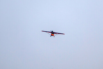 propeller plane is flying on isolated blue sky 