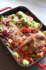 A wholesome and flavorful dish featuring oven-roasted turkey breast, crispy bacon, Brussels sprouts, red onions, and red bell peppers.