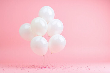 bunch of white balloons floating in the air