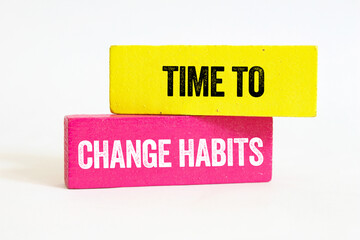 Time to change habits message written on wooden blocks on white background. Conceptual time to change habits symbol. Copy space.