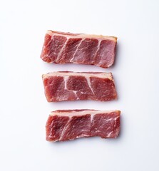 Fototapeta premium Fresh Cuts of Raw Meat Displayed on a White Background for Culinary Inspiration and Food Photography Projects