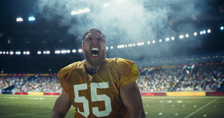 Portrait of an American Football Player Hydrating with Water During a Tournament Match. Male Athlete Pouring Water on His Face, Feeling Energized and Ready for Action on a Packed Stadium