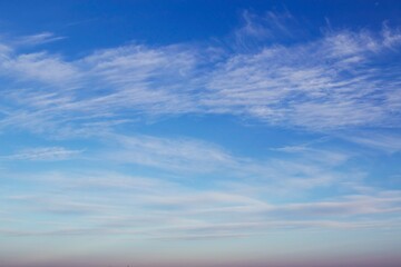 Obraz premium Blue sky with beautiful white clouds. Sky with cumulus and cirrocumulus clouds. Panoramic image of the sky.