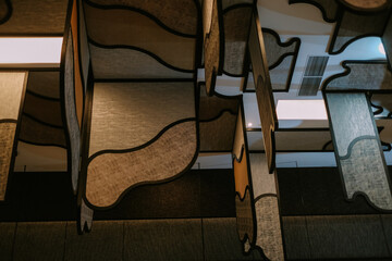 Stylish acoustic panels hanging from the ceiling for noise reduction