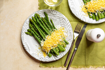 Top view of dish asparagus Mimosa, blanched asoparagus served with  the hard boiled egg on top...