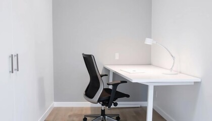 Modern Minimalist Home Office Setup: White Desk, Ergonomic Chair, and Desk Lamp