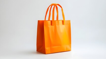 A vibrant orange shopping bag sits on a white background