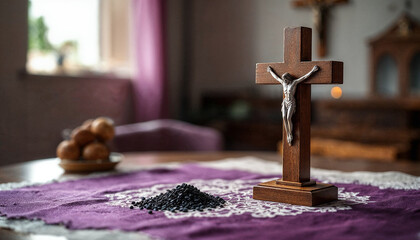 a cross on the table and a small pile of ashes
