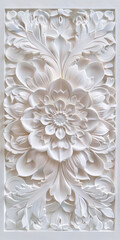 Intricate floral relief sculpture with detailed petals and leaves in white marble design