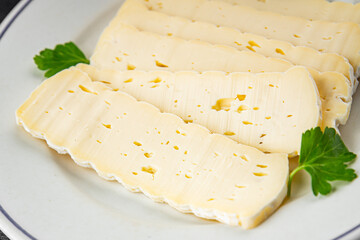 Tartiflette cheese slices soft cheese tasty fresh gourmet food background on the table rustic food top view copy space