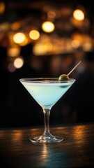 Classic Martini Cocktail with Green Olive Garnish in Elegant Bar Setting