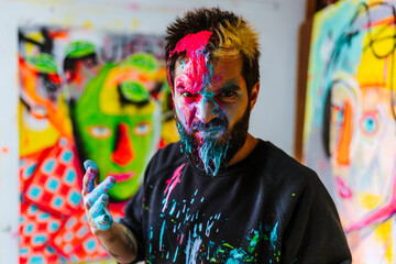 Passionate Artist Covered in Paint Expressing Creativity. An expressive Argentine artist stands in...