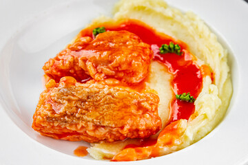 Fish dish tomato sauce and mashed potatoe tasty fresh gourmet food background table rustic food top view copy space