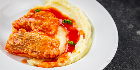 Fish dish tomato sauce and mashed potatoe tasty fresh gourmet food background table rustic food top view copy space