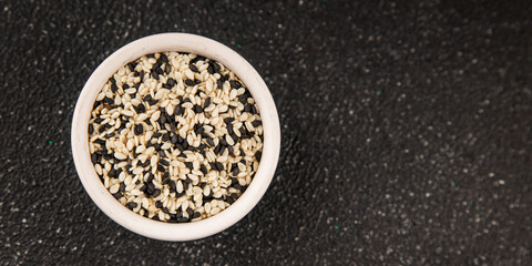 Sesame spice mix white and black tasty fresh gourmet food background on table rustic food top view copy space