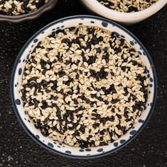 Sesame spice mix white and black tasty fresh gourmet food background on table rustic food top view copy space