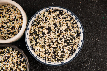 Sesame spice mix white and black tasty fresh gourmet food background on table rustic food top view copy space