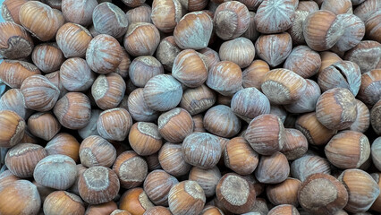 Hazelnuts in shells lie in a random order.