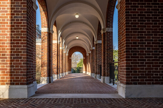 Old arched brick walkway with brick pillars