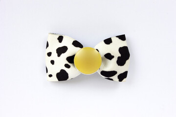 Hair clips decorated with cute dolls and ribbons, colorful, isolated on white.