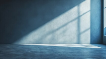 Sunlight enters a spacious, minimalist room, casting long shadows on the concrete floor. The serene atmosphere highlights the simplicity and tranquility of the space