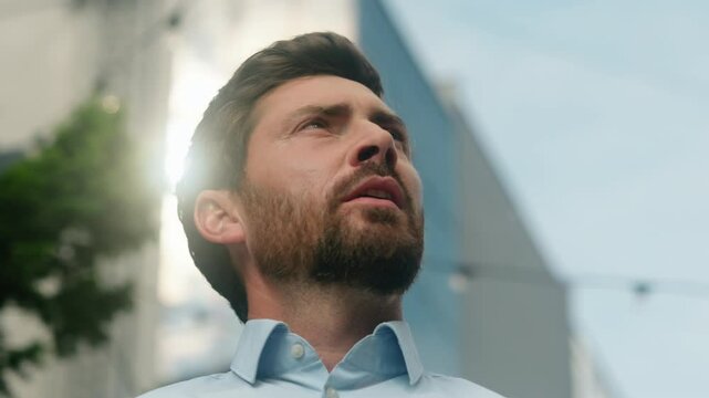 Close up Caucasian manager investor urban trader developer looking around look in sky lost in city navigation European man businessman guy male business thinking searching office company building