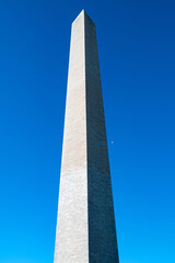peak of the Washington Monument against a clear blue sky.