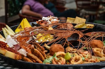 seafood on a plate - sample food in a restaurant in Suracuse, Sicily	
