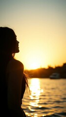 A young woman enjoy sunrise on the water Poster vertical