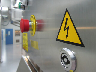 Stainless steel electrical cabinet with emergency stop button.
