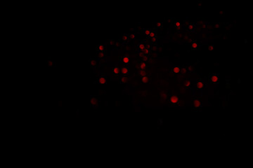 Red blurred bokeh lights on black background. Glitter sparkle confetti for celebrate. Overlay for...