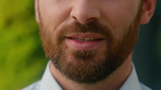 Close up cropped view Caucasian half face mouth lips smiling toothy unrecognizable European bristle bearded man smile white tooth healthy dental oral medicine businessman guy male business in city