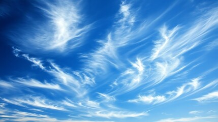 The vast sky above is adorned with clouds stretching endlessly across the horizon, their wispy tendrils drifting in the wind. Billowing formations rise and fall, casting shifting shadows upon the land