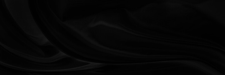 Black gray satin dark fabric texture luxurious shiny that is abstract silk cloth panorama background with patterns soft waves blur beautiful.