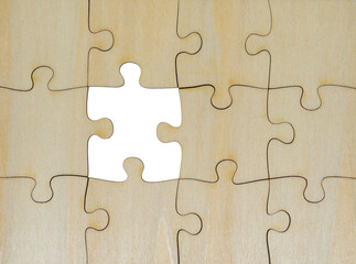wooden jigsaw puzzle forming a rectangle; problem solving, teamwork and strategy concept