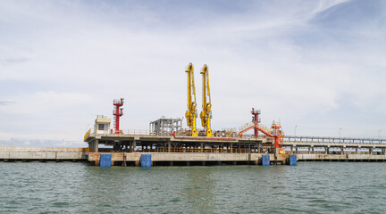 An industrial oil jetty platform with machinery and equipment