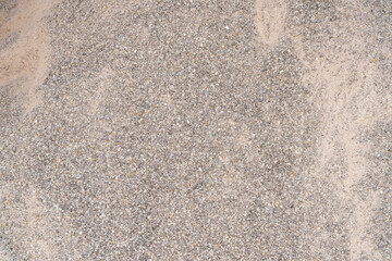 Pile of crushed stones and sand. Construction materials background. Gravel and sand texture for building and roadwork.