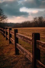 Obraz premium Beautiful wooden fence in a peaceful field